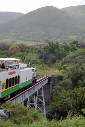  ??  ?? RIGHT:
Lyd No 2 crossing a steel bridge near Mansion heading up a ‘ghut’ on the east
side of the island.