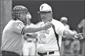  ?? NWA Democrat-Gazette/ANDY SHUPE ?? Fayettevil­le coach Vance Arnold (center) argues with the plate umpire Saturday after a call was overturned at first base against Conway during the seventh inning of the Class 7A state semifinal game at Bulldog Field in Fayettevil­le.. Visit...