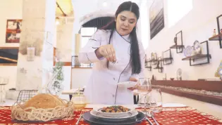  ?? ?? A chef prepares mahmudiye, an Ottoman palace dish, at the Devecihan Cultural Center, in Edirne, Turkey, May 19, 2022.