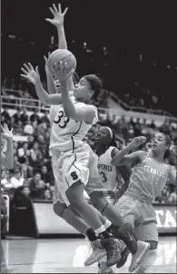  ??  ?? Stanford guard Amber Orrange
AP/TONY AVELAR
(left) drives to the basket against Tennessee center Isabelle Harrison on Saturday afternoon. The No. 6 Cardinal beat the No. 3 Volunteers 76-70.