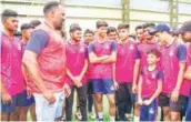  ?? ?? Hamilton Masakadza, the Director of Zimbabwe Cricket, interacts with young trainees during his visit to the Omtex ICWC Cricket Institute at Saphale, Palghar on Wednesday