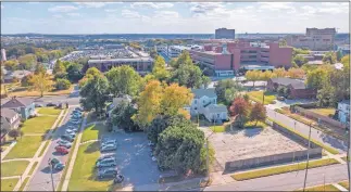  ?? [DAVE MORRIS/ THE OKLAHOMAN] ?? The former Brockway Center, shown to the right, is set to be sold by The CARE Center to the Oklahoma City Redevelopm­ent Authority while its parking lot will stay with The CARE Center, which is to the left of Brockway. The CARE Center will then be allowed to expand into it's current parking lot.