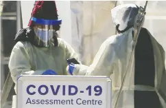  ?? Veronica Henri/ / postmedia news ?? A COVID-19 Assessment Centre was set up outside of Scarboroug­h Health Network — Birchmount Hospital in
the Toronto area last weekend.