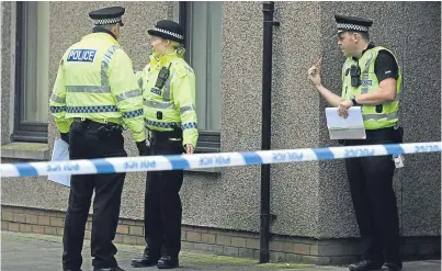  ?? Picture: Dougie Nicolson. ?? Police Scotland officers working on a murder case in Montrose.