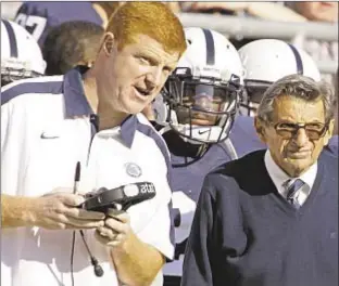  ?? AP ?? Penn State football assistant Mike McQueary (l.) is awarded $7.3 million in damages for claiming the school defamed him after he testified at Jerry Sandusky’s trial.