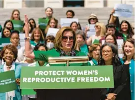  ?? ANDREW HARNIK/AP ?? House Speaker Nancy Pelosi, with female House Democrats, speaks ahead of a House vote on the Women’s Health Protection Act on Friday at the U.S. Capitol.