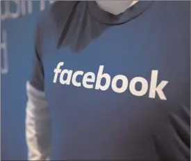  ?? The Canadian Press ?? Guest are welcomed by people in Facebook shirts as they arrive at the Facebook Canadian Summit in Toronto.