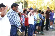  ??  ?? N.O. Benavidez (left), Korean War veteran and other attendees at the Flag Day flag retirement ceremony at the Veterans Memorial at Bucklin Park Wednesday in El Centro. WILLIAM ROLLER PHOTO