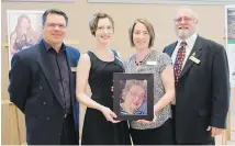  ?? SUBMITTED ?? North Island College vice-president Randall Heidt, left, NIC Foundation representa­tives Erin Petersen and Jolean Finnerty, and Comox Valley Community Foundation president Norman Carruthers with a photo of the late Catherine Mary Aitken, who donated $6...