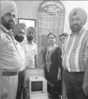  ?? HT PHOTO ?? District health administra­tion and Model Town police officials with the seized portable ultrasound machine at Haibowal area in Ludhiana on Monday.