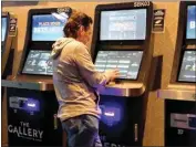  ?? WAYNE PARRY / AP ?? A man checks the odds on a sports betting terminal at the Ocean Casino Resort in Atlantic City, N.J. on Monday.