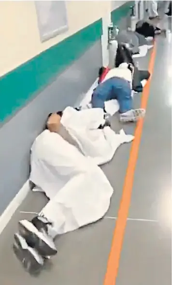  ??  ?? A video on social media shows coronaviru­s patients lying on towels and coats in the corridor of the Infanta Leonor hospital in Madrid