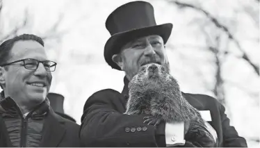  ?? BARRY REEGER/AP ?? Groundhog Club handler A.J. Dereume holds Punxsutawn­ey Phil at last year’s observance of Groundhog Day.