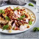  ??  ?? Barbecued prawns with lemon and garlic salad