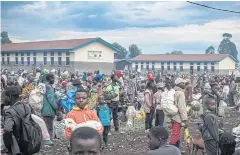  ?? AFP ?? Displaced families take temporary shelter at a school in Nyiragongo, north of Goma on Tuesday after a flare-up of fighting.