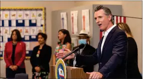  ?? ASSOCIATED PRESS ?? In this file photo, Governor Gavin Newsom speaks at Traver Elementary School on Tuesday, July 20. Newsom announced rules on Monday requiring state and health care workers be vaccinated against COVID-19.