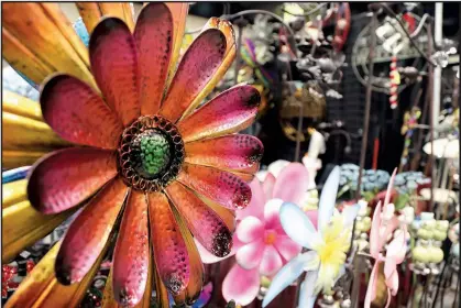  ?? University of Arkansas System Division of Agricultur­e/RYAN McGEENEY ?? Vendors will have whimsical as well as practical garden fixtures for sale along with plants and tools when the 2018 Arkansas Flower and Garden Show opens at the Arkansas State Fairground­s on March 2.