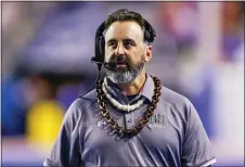  ?? STEVE CONNER — THE ASSOCIATED PRESS FILE ?? Hawaii head coach Nick Rolovich walks the sideline during a game against Boise State, in Boise, Idaho. Rolovich dived right in when Washington State hired him.