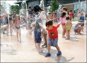  ?? Janelle Jessen/Herald-Leader ?? Children play in the new splash pad at Memorial Park during the grand opening in May.