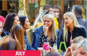  ??  ?? JULY
Refreshing change: Customers at a beer garden in Glasgow