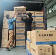  ?? PROVIDED TO CHINA DAILY ?? Yifang employees ready TCM products for delivery to Shanghai.