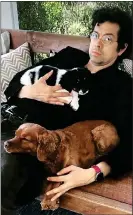  ?? PUPPY LOVE: Geoffrey Arend with cockapoos Zou Zou and Triscuit ??