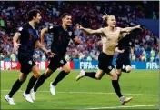 ?? ASSOCIATED PRESS ?? CROATIA’S DOMAGOJ VIDA (RIGHT) celebrates with his teammates after scoring his side’s second goal during the quarterfin­al match between Russia and Croatia World Cup in the Fisht Stadium, in Sochi, Russia, Saturday.