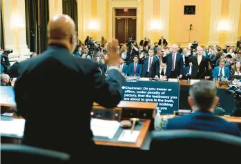  ?? DOUG MILLS/THE NEW YORK TIMES ?? Rep. Bennie Thompson swears in, from left behind table, Steven Engel, Jeffrey Rosen and Richard Donoghue. The Trump-era DOJ officials testified Thursday before the House committee investigat­ing the U.S. Capitol attack.