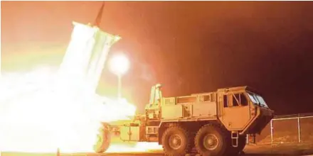  ?? EPA PIX ?? A Terminal High Altitude Area Defence intercepto­r being launched from the Pacific Spaceport Complex Alaska in Kodiak, Alaska, on Sunday.