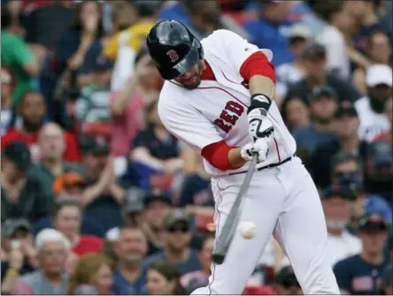  ?? MICHAEL DWYER — THE ASSOCIATED PRESS FILE ?? In this file photo, Boston Red Sox’s J.D. Martinez hits a two-run home run during the fifth inning against the Baltimore Orioles in a baseball