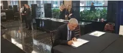  ?? (Courtesy) ?? FINANCE MINISTER MOSHE KAHLON signs the official book of condolence­s at the funeral of former US president George H.W. Bush in Washington yesterday.