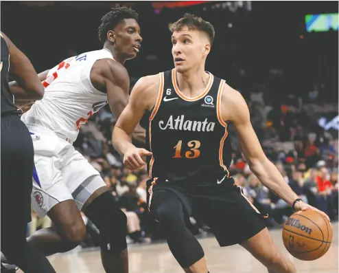  ?? ALEX SLITZ / GETTY IMAGES ?? Three-point sharpshoot­er Bogdan Bogdanovic of the Atlanta Hawks would be a big hit in Dallas with the Mavericks as the primary catch-and-shoot option next to superstar Luka Doncic.