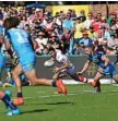  ?? Photo: Kevin Farmer ?? ELUSIVE: Halfback Ben Hunt tries to evade the Titans defensive line in Toowoomba.