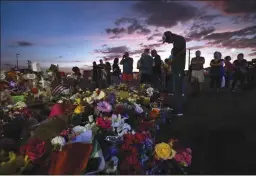  ?? CAROL GUZY/ZUMA PRESS ?? Antonio Basco stands silently at his wife’s cross as family members visit a memorial site after funeral services for Walmart mass shooting victim Margie Reckard on Aug. 17, 2019 in El Paso, Texas.