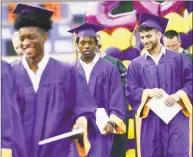  ?? Matthew Brown / Hearst Connecticu­t Media ?? Noldylens “Noodles” Metayer, center, returns to his seat after receiving his diploma during graduation from Westhill High School on Friday in Stamford.