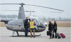  ?? BOB TYMCZYSZYN TORSTAR FILE PHOTO ?? Passengers prepare to board a Great Lakes Helicopter at Niagara District Airport, in this January file photo.