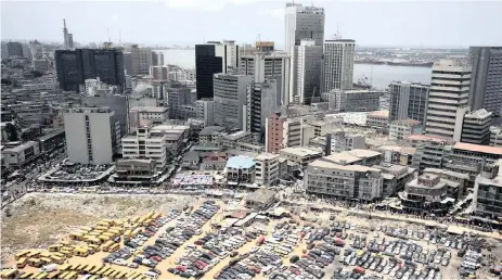  ?? Reuters ?? Lagos is a city in the Nigerian state of Lagos. With its adjoining conurbatio­n, it is the most populous city in Nigeria, and in Africa. The writers say we can learn a lot from it. |