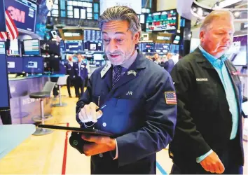  ?? AP ?? Traders at the New York Stock Exchange. The S&P 500 has lost an average of 1.1 per cent in September over the last 20 years.