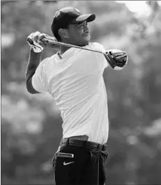  ?? ANDY LYONS/GETTY ?? Tiger Woods hits a tee shot in a practice round Wednesday at Olympia Fields.