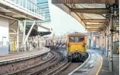  ?? Gordon Edgar ?? RIGHT: GB Railfreigh­t’s 73116 Selhurst and 73119 Borough of Eastleigh work 3W90, the 04.35 Tonbridge West Yard to Tonbridge West Yard RHTT diagram, passing through Platform 17 at Clapham Junction on November 24, 2022.