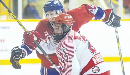  ?? JULIE JOCSAK/POSTMEDIA NEWS ?? St. Catharines Falcons forward Lucas Smilsky, foreground, and Welland Jr. Canadians defender Nicholas Boehmer fight for the puck in junior B hockey in this September 2016 file photo. Smilsky was selected as the Falcons most valuable player after...