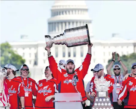  ?? JACQUELYN MARTIN/THE ASSOCIATED PRESS/FILES ?? Washington Capitals captain Alex Ovechkin is among the list of players who have chugged beer upside down from the Stanley Cup — known as a Cup stand — this summer, a practice that may be banned during hometown visits after this year.