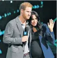  ??  ?? The Duke and Duchess of Sussex embrace after Meghan joined her husband on stage