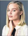  ?? AP PHOTO ?? Actress Margot Robbie, a cast member in the film, “I, Tonya,” poses for a portrait at The Hollywood Roosevelt Hotel in Los Angeles on Dec 5. The film tells the story of the disgraced figure skater Tonya Harding.
