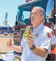  ?? JIM THOMPSON/JOURNAL ?? Albuquerqu­e Fire Department Chief David Downey explains how to differenti­ate between legal and illegal fireworks based on their labeling.