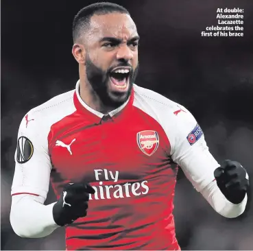  ??  ?? At double: Alexandre Lacazette celebrates the first of his brace