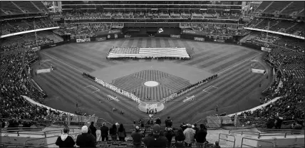  ?? GODOFREDO A. VÁSQUEZ / ASSOCIATED PRESS ?? A sparse crowd stand for the national anthem Thursday before the home opener for the Oakland Athletics, who were hosting the Cleveland Guardians. The A’s announced attendance of 13,522 was just about half of the 26,805 that the team drew last year for the season’s first game.