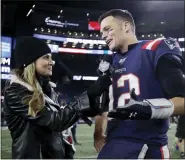  ?? ASSOCIATED PRESS FILE PHOTO ?? Fox Sports television sideline broadcast reporter Erin Andrews, left, interviews then-new England Patriots quarterbac­k Tom Brady at midfield after a 2019game between the Patriots and the New York Giants in Foxborough, Mass.