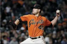  ?? JEFF CHIU — THE ASSOCIATED PRESS ?? San Francisco Giants pitcher Matt Moore delivers to the plate during Friday night’s game in San Francisco.