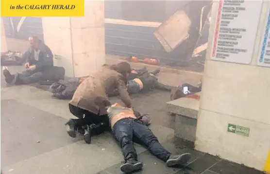  ?? WWW.VK.COM / SPB_TODAY / THE ASSOCIATED PRESS ?? Blast victims lie near a subway train that was hit by an explosion at the Technologi­chesky Institute metro station in St.Petersburg, on Monday.